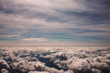 Morning sunshine above the clouds - welcome a new day through an airplane window on an extended...