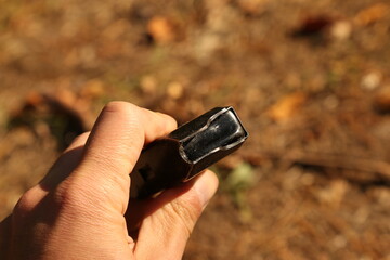 Fototapeta premium Empty machine gun magazine in hand