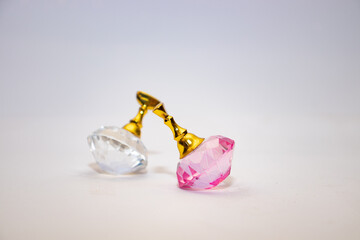 Two lonely colored crystals on white 