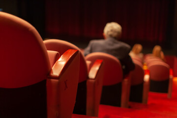 theater audience taking a seat before performance
