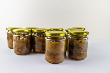 Batch of home made marrow chutney jars.