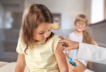 Little Girl Getting Vaccinated Against Covid, Doctor Applying