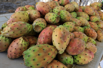 Whole Prickly prickly figs freshly ripe on the market stall.