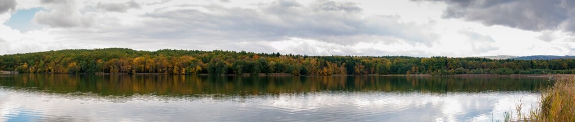 Fototapeta na wymiar panorama of forest lake on sunny day beautiful autumn