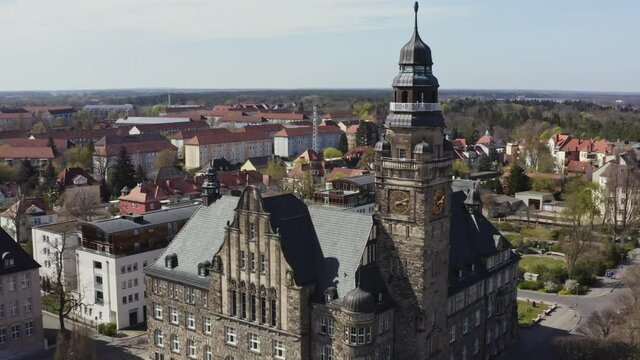 The drone flies towards the side of the town hall of Wittenberge. A small town in Brandenburg, Germany.