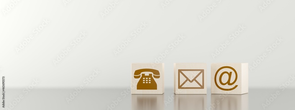 Wall mural three wooden blocks with brown phone, letter and e-mail symbol icons on black table, communication c