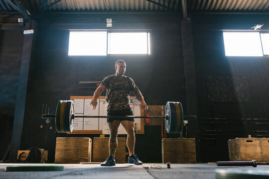 Athlete releasing the heavy bar during training