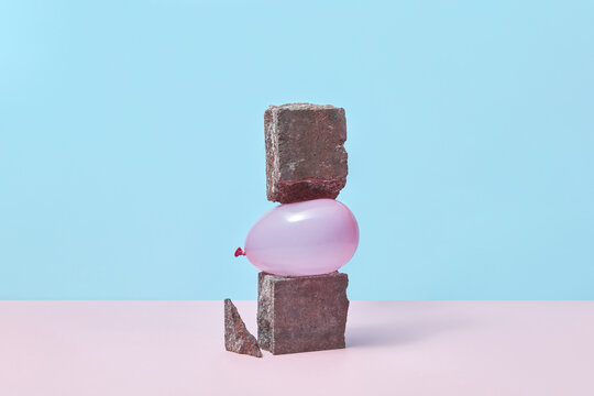 Violet balloon between stones