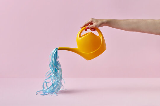 Woman with watering can and stripes