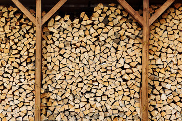 the wall of firewood is beautifully built