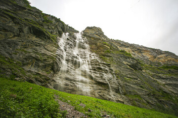 Fototapeta na wymiar Big cascade with long exposure in Lauterbrunnen, swiss mountains