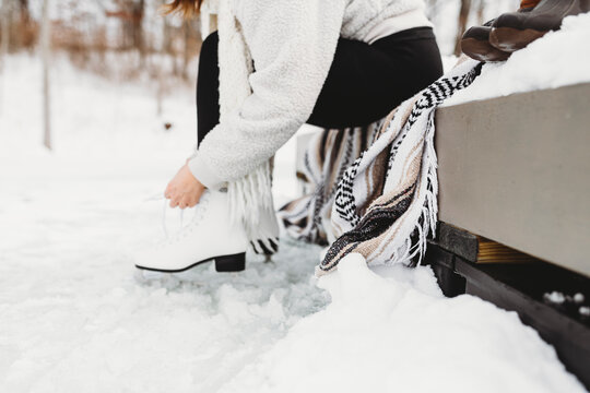 Ice skating on a pond in the winter.