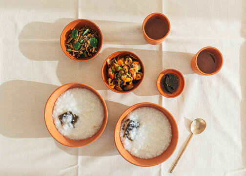 Flat lay of congee and side dishes