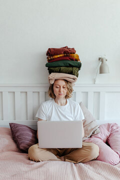 Woman busy with problem of decluttering