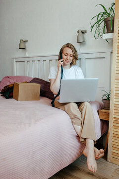 Woman with gadgets getting rid of clothes