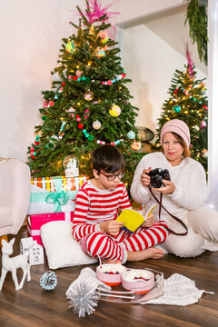 Mother and son in pajamas in Christmas morning