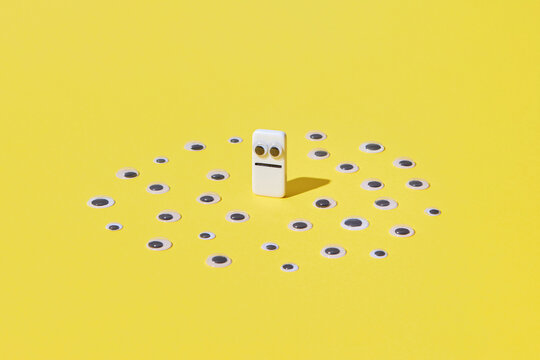 Domino piece with sad eyes