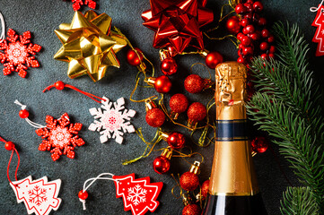 New Year composition with golden champagne bottle and christmas decor. New Year Flatly. Christmas flatlay. New year 2022. New year concept