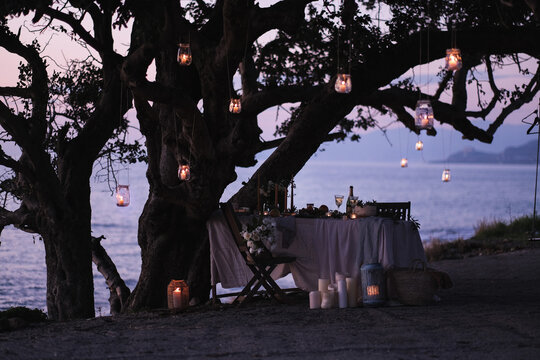 Decorated table under a tree at seashore