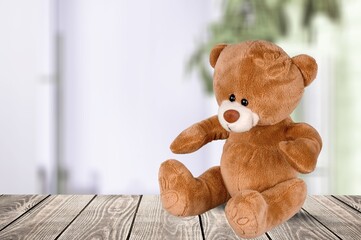 Cute brown toy bear on the desk