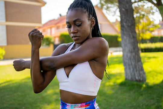 Black Woman Stretching Muscles After Doing Sports. 