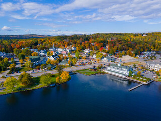 Meredith town center with fall foliage aerial view in fall with Meredith Bay in Lake Winnipesaukee, New Hampshire NH, USA.  - obrazy, fototapety, plakaty