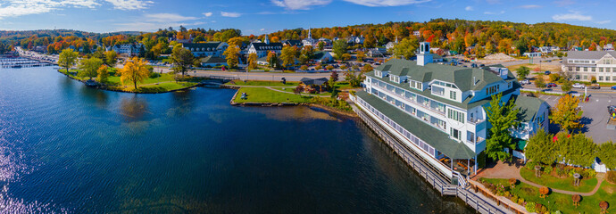 Bay point at Mill Falls with fall foliage panoramic aerial view with Meredith Bay in Lake Winnipesaukee in town of Meredith, New Hampshire NH, USA.  - obrazy, fototapety, plakaty