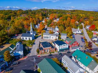 Meredith town center with fall foliage aerial view including First Congregational Church and Mill Falls, New Hampshire NH, USA. 