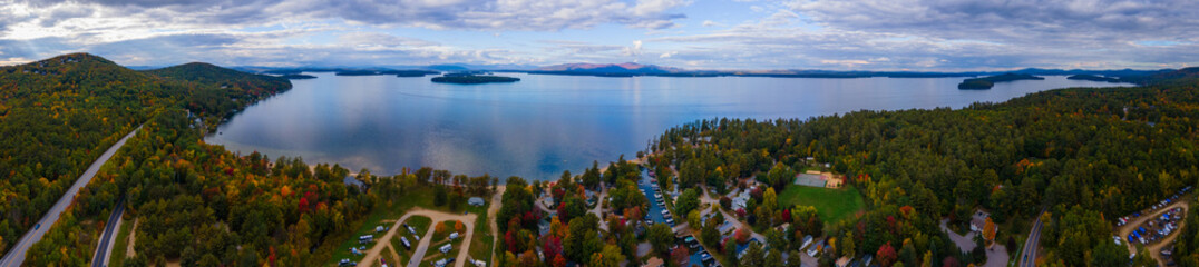 Aerial view of Lake Winnipesaukee in fall with Ossipee Mountains at the background, from Ellacoya State Park in town of Gilford, New Hampshire NH, USA. This mountains belong to White Mountains. 