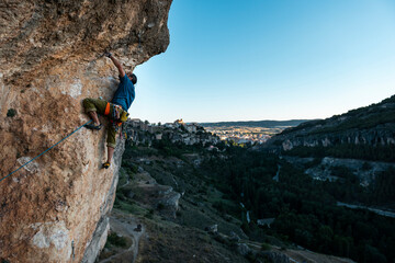 Mature climber climbing on crack