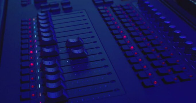 equalizers move on a modern digital audio mixer. sound equipment. close-up.