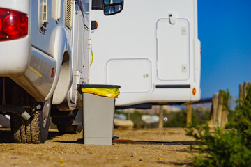 Trash can in front of caravan