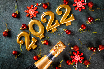 2022 numbers with champagne bottle and decor. Happy new year and festive concept. Top horizontal view copyspace. New Year Flatly. Christmas flatlay. New year 2022. New year concept.