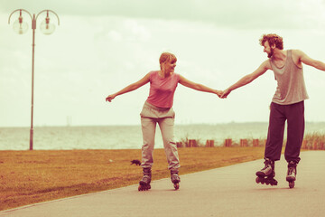 roller skater couple skating outdoor