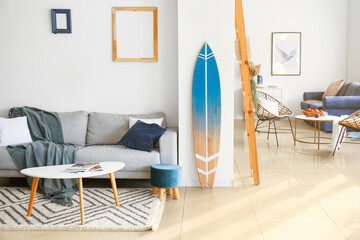 Interior of modern room with stylish surfboard - obrazy, fototapety, plakaty