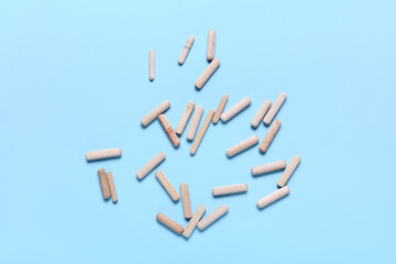 Scattered dowels on color background