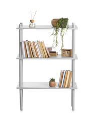 Modern bookcase with decor on white background