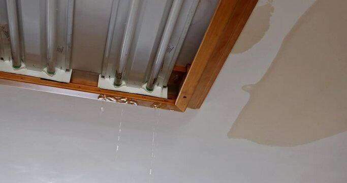 Ceiling kitchen in damage caused by a leaking water pipe a water drops on the ceiling