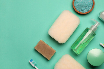 Bath supplies with sponges on color background