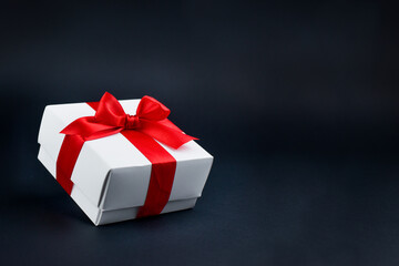 Gift in a white box on a black background