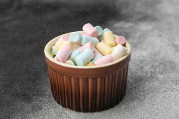 Ramekin with tasty marshmallows on dark background, closeup