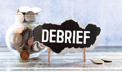 debrief word in a dictionary. debrief concept