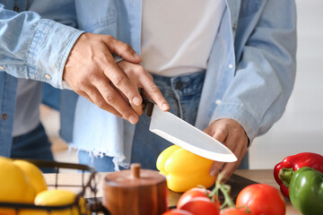 Young couple cooking in kitchen, closeup. Vegan Day