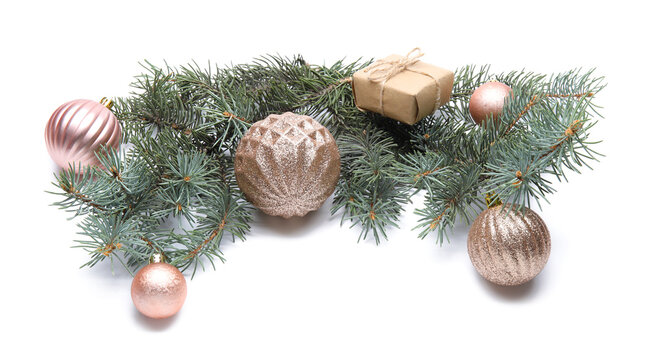 Fir branch, gift box and Christmas balls on white background