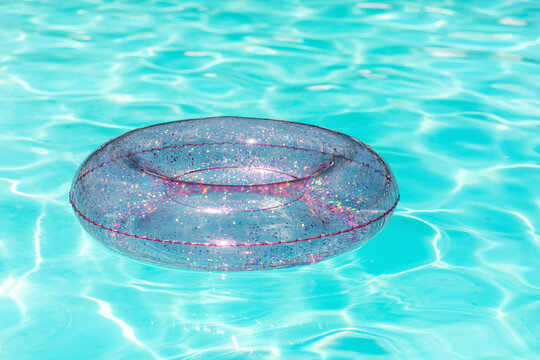 Glittering float on shiny pool water