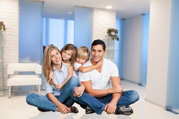 Family with the little child resting in living room