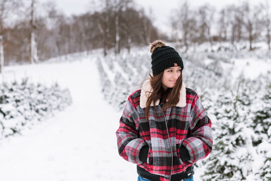 A portrait of a young woman in the snow