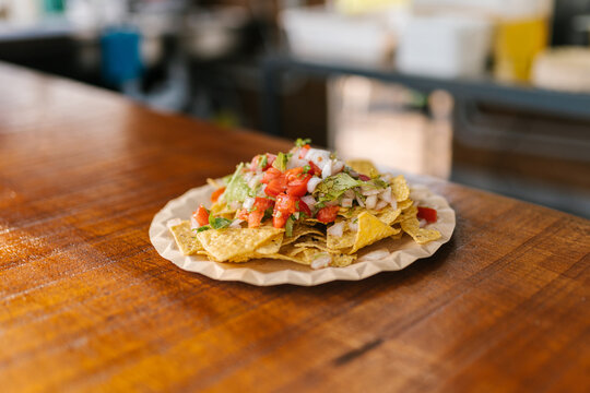 Plate with nachos in restaurant