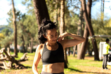 adult Caucasian woman exercising on a mat in the forest