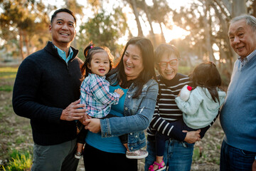 Three happy generations laughing together